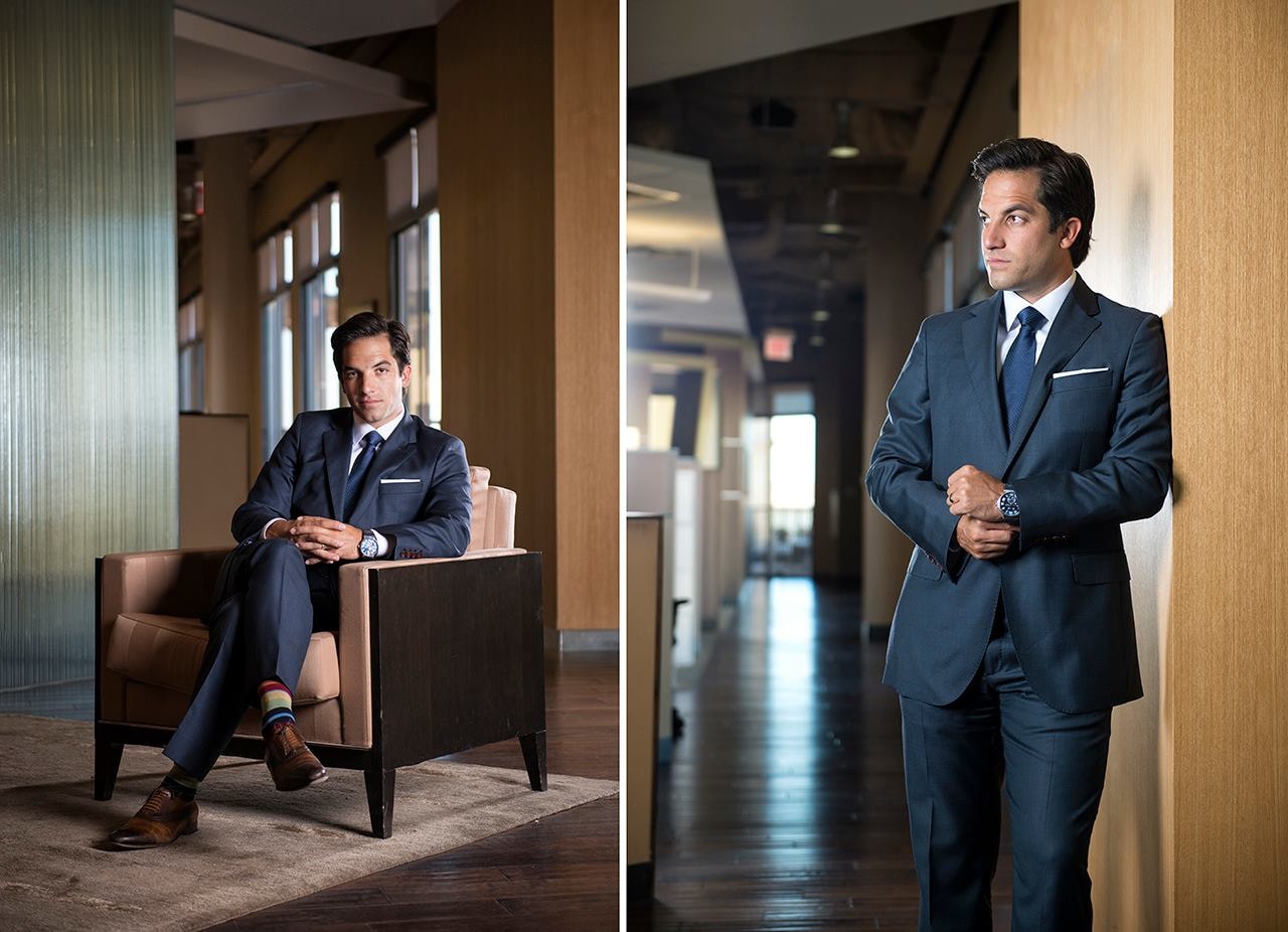 Man in navy suit, modern office portrait